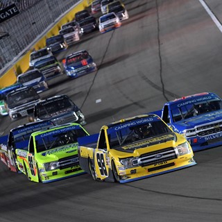 Eventual winner Grant Enfinger (98) leads the field on a restart during the NASCAR Camping World Truck Series World of W