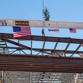 The "final" signed beam is lifted into place