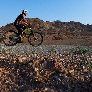 A mountain bike rider makes his way across one of the lower Bootleg Canyon trails