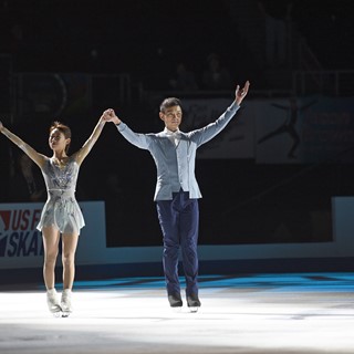 Gold medalist Peng Cheng and Jin Yang of China skate together after winning the pairs competition
