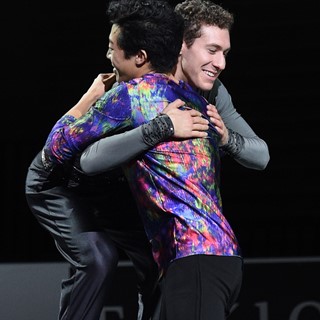 Silver medalist Jason Brown (R) of the United States embraces gold medalist Nathan Chen