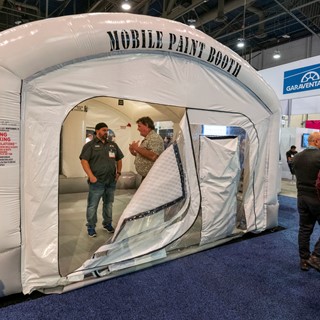 An inflatable mobile paint booth