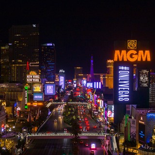 Strip view that feature #ONLYVEGAS on property marquees