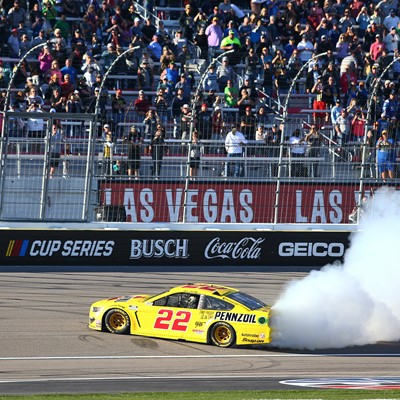 Joey Logano (22) does a burnout