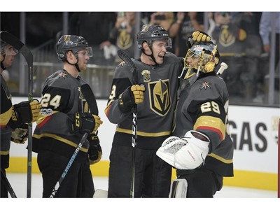 Vegas Golden Knights defenseman Brayden McNabb (3) congratulates Vegas Golden Knights goalie Marc-Andre Fleury (29)
