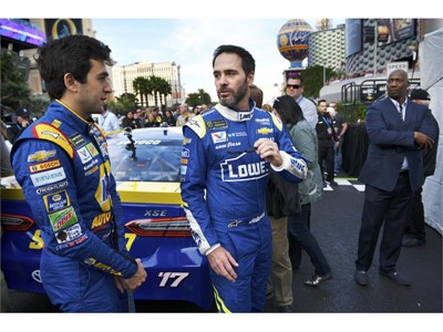 NASCAR Cup Series driver Jimmie Johnson, right, talks with Chase Elliott