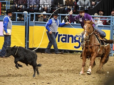 Timber Moore from Aubry, Texas, competes in tie-down roping