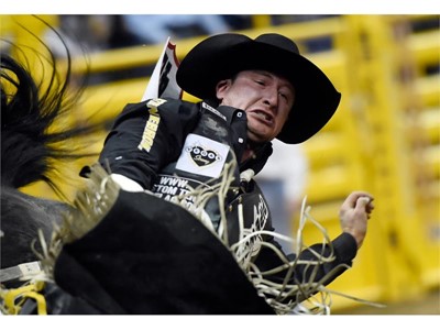 Jake Vold from Ponoka, Alberta, Canada, competes in bareback riding in the seventh go-round of the National Finals Rodeo