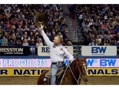 Brady Minor acknowledges the crowd after competing in the team roaring during the seventh go-round of the National Final