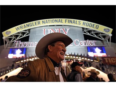 Delbert Warren of Oklahoma is all smiles before as he arrives for the seventh go-round of the National Finals Rodeo