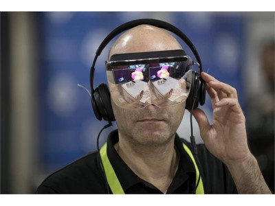 Yaron Asher tries out a virtual reality headset from start-up Mira Reality