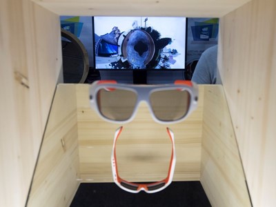 Glasses which film in 360 degrees, with footage displayed in the background, are seen during the first day of CES