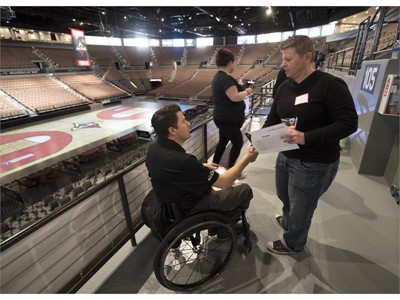 Las Vegas Aces Director of sales Aaron Johnson talks with a fan