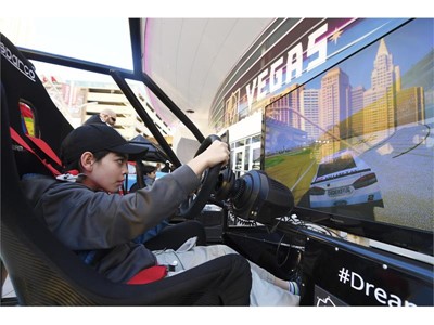 Ethan Chase of Las Vegas tries out a driving simulation