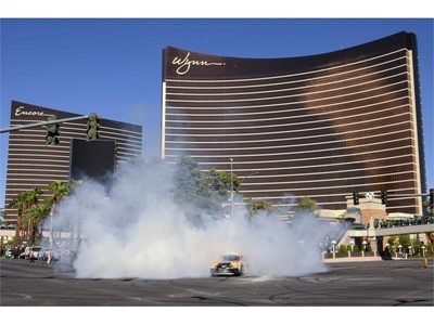 Erik Jones emerges from a cloud of smoke during the 2018 NASCAR Burnout Blvd