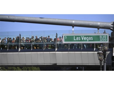 Fans line a pedestrian overpass to watch the action during the 2018 NASCAR Burnout Blvd