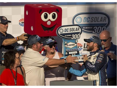 Ross Chastain #42, right, is awarded a trophy after winning the NASCAR Xfinity Series DC Solar 300