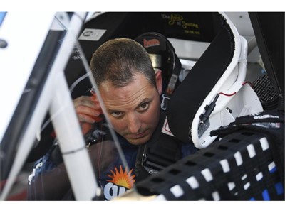Johnny Sauter (21) Allegiant Chevrolet Silverado puts in his ear piece
