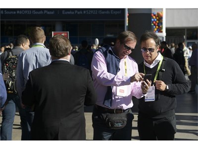 Attendees check their phone