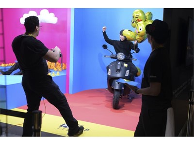 An attendee has his photo taken