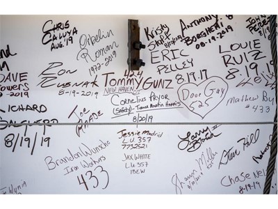 Signatures decorate the "final beam"