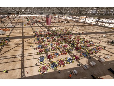 Workers gather inside the new exhibit hall as Turner/Martin-Harris recognizes its tradespeople
