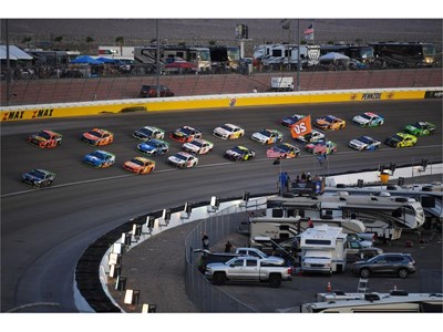 The field heads through turn three
