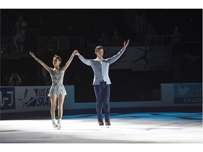 Gold medalist Peng Cheng and Jin Yang of China skate together after winning the pairs competition
