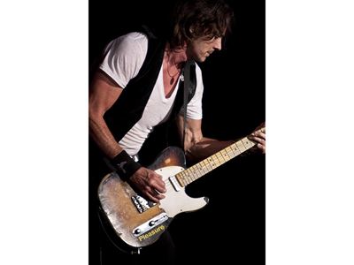 5. Rick Springfield Playing Guitar During Concert