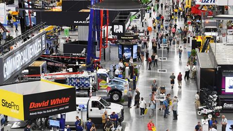 Attendees walk the Las Vegas Convention Center West Hall exhibit hall during the first day of the World of Concrete expo
