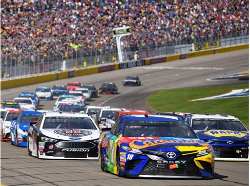 The field heads into turn one on a restart during the Monster Energy NASCAR Cup Series Pennzoil 400