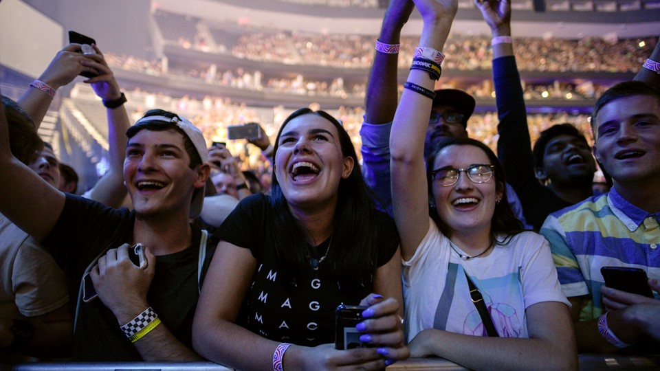 Fans cheer as Imagine Dragons performs