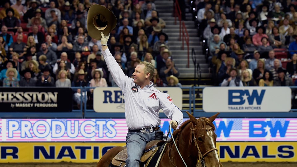 Brady Minor acknowledges the crowd after competing in the team roaring during the seventh go-round of the National Final