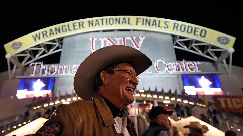 Delbert Warren of Oklahoma is all smiles before as he arrives for the seventh go-round of the National Finals Rodeo