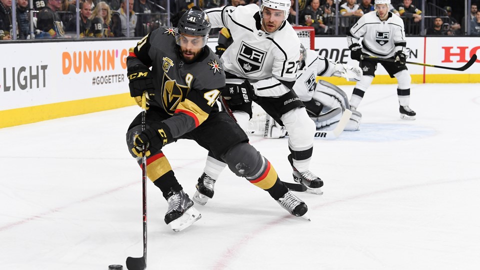 Vegas Golden Knights left wing Pierre-Edouard Bellemare is defended by Los Angeles Kings defenseman