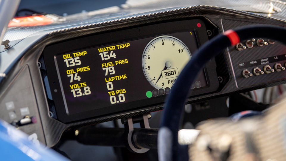The digital dashboard of a car is lit up during tuning in preparation for the 2018 NASCAR Burnout Blvd
