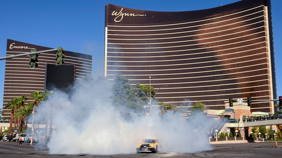 Erik Jones emerges from a cloud of smoke during the 2018 NASCAR Burnout Blvd