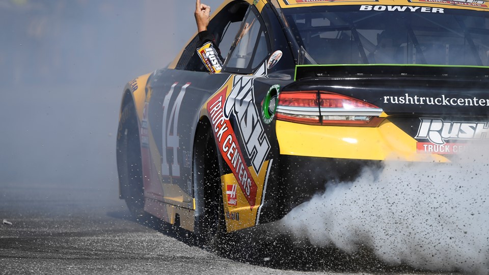 Clint Bowyer (14) points to the sky while doing donuts during the 2018 NASCAR Burnout Blvd
