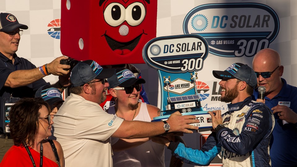 Ross Chastain #42, right, is awarded a trophy after winning the NASCAR Xfinity Series DC Solar 300