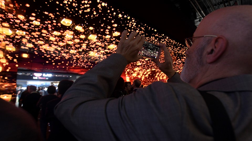 Attendees take photos