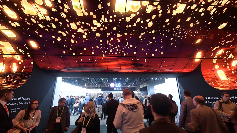 Attendees walk through the entry