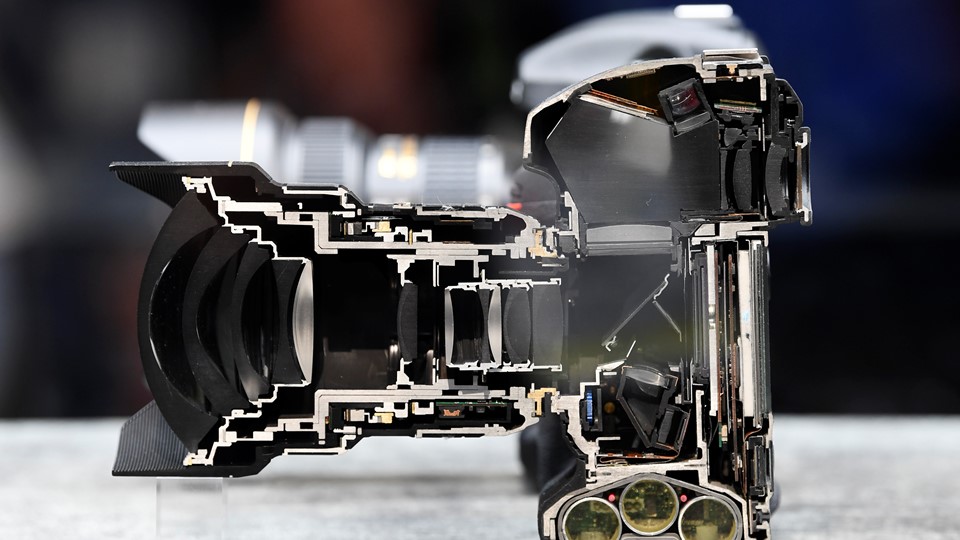 A Nikon D5 camera is displayed cut in half