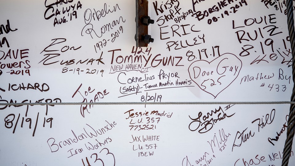 Signatures decorate the "final beam"