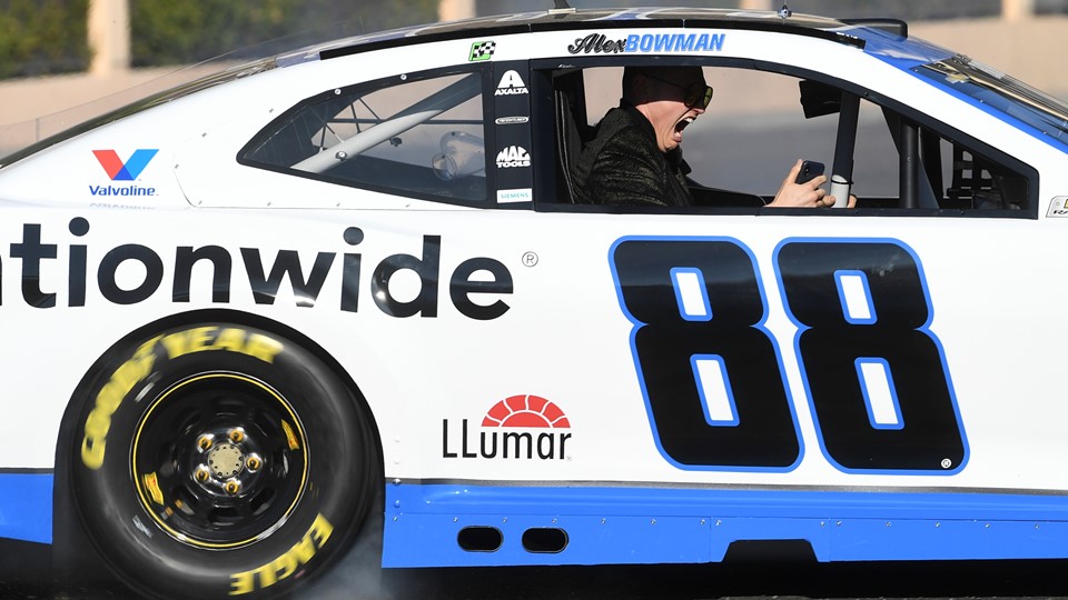 A passenger in Alex Bowman's car
