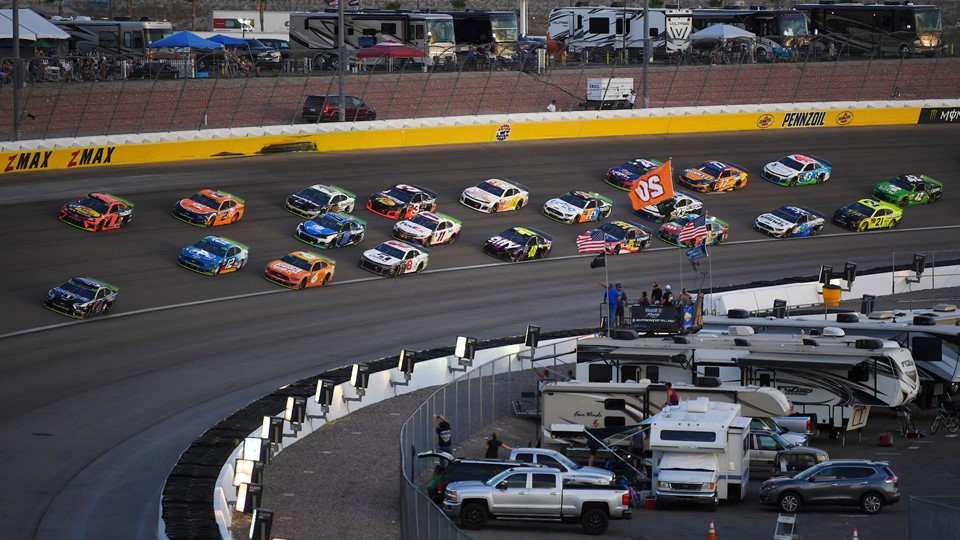 The field heads through turn three