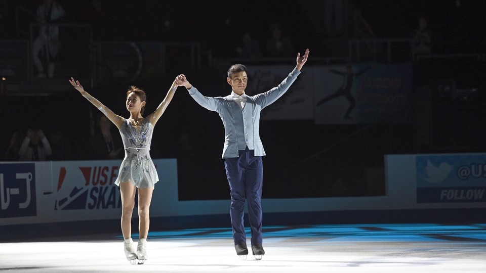 Gold medalist Peng Cheng and Jin Yang of China skate together after winning the pairs competition
