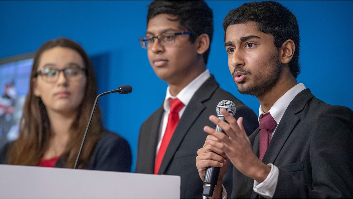 Anish Chejerla, right, with teammates Elizabeth Wigington and Ishaan Raja