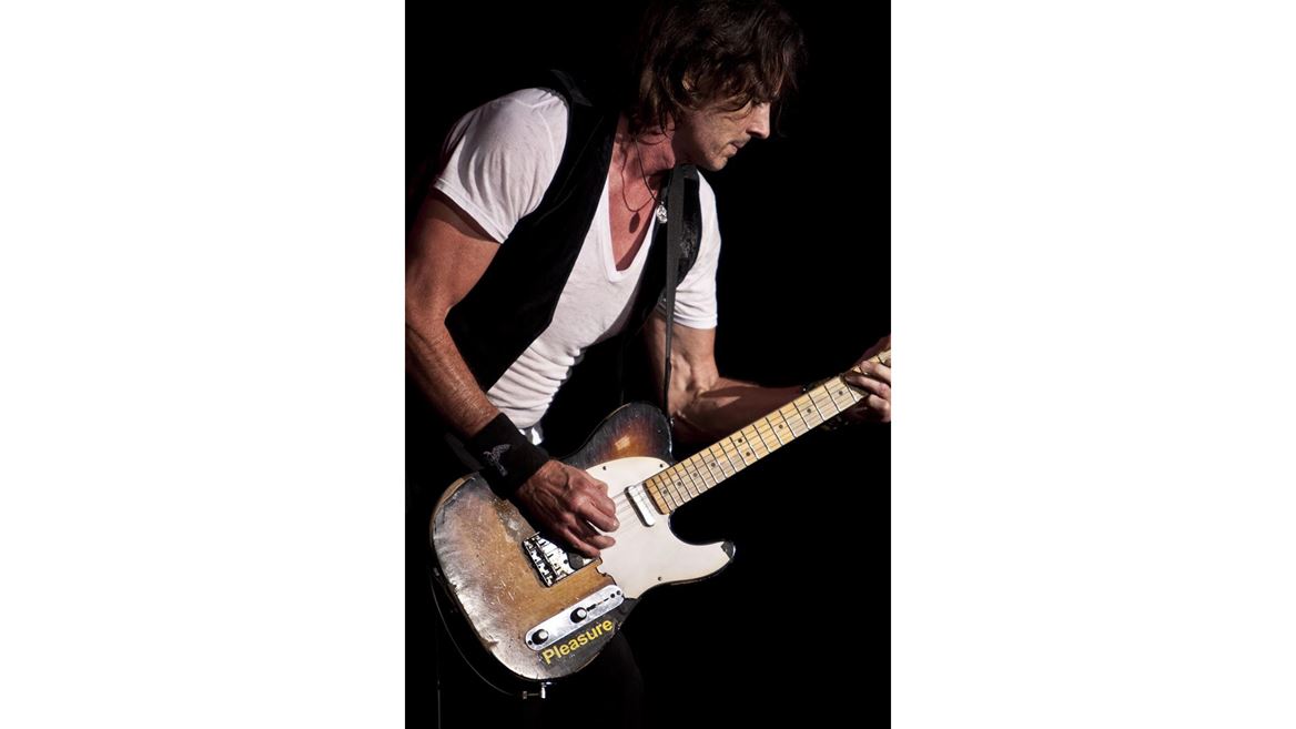 5. Rick Springfield Playing Guitar During Concert