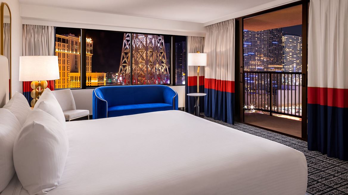 Paris Las Vegas Versailles Tower Balcony Room King Bed Eiffel Tower View credit Caesars Entertainment