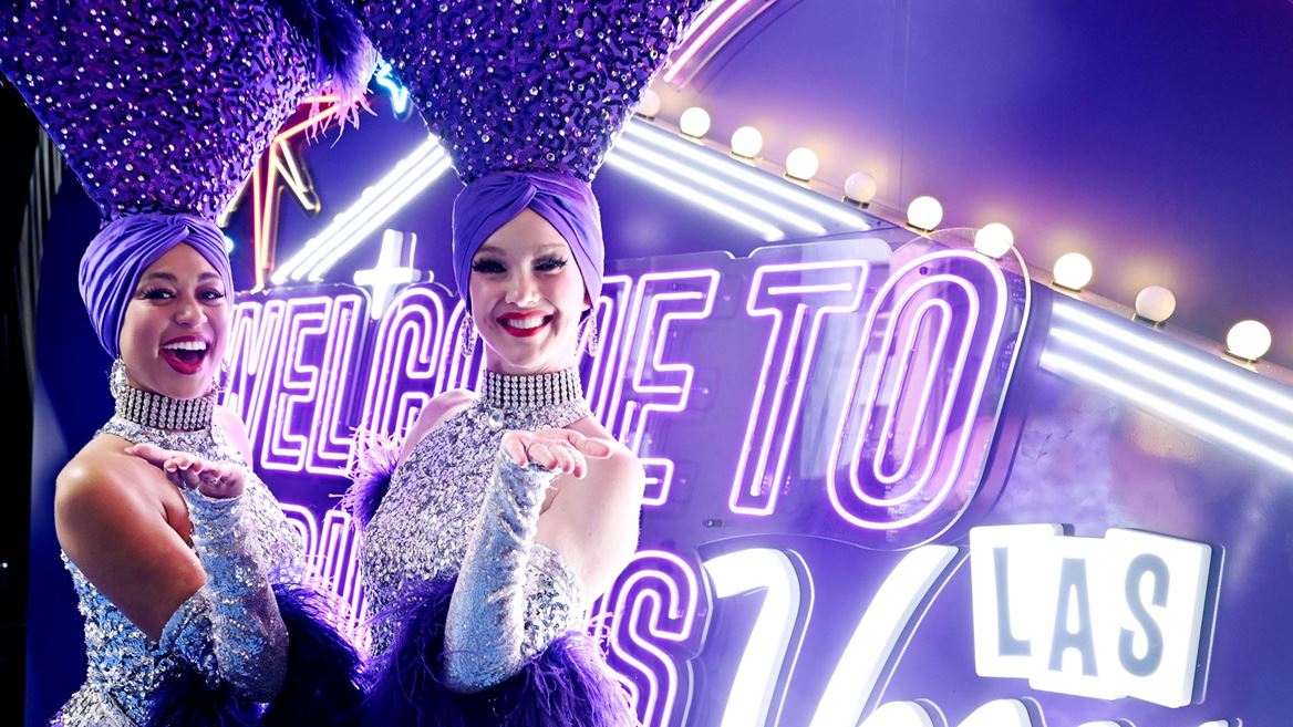 Showgirls in front of Fabulous Pickups Sign